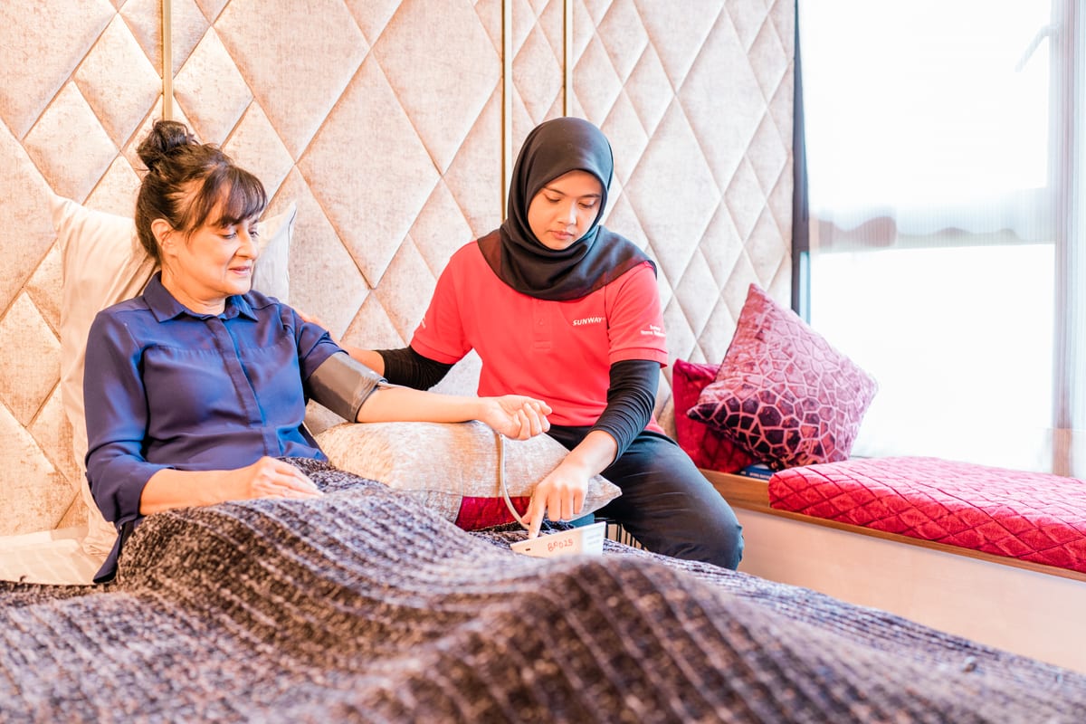 Nurse visiting patient at home